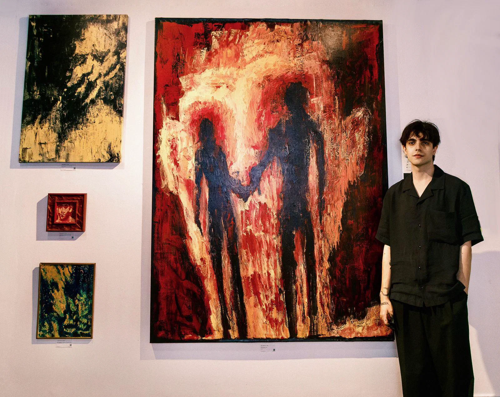Andrada beside One Without Half at Art Week Toronto, August 2026, with three smaller works to its left.