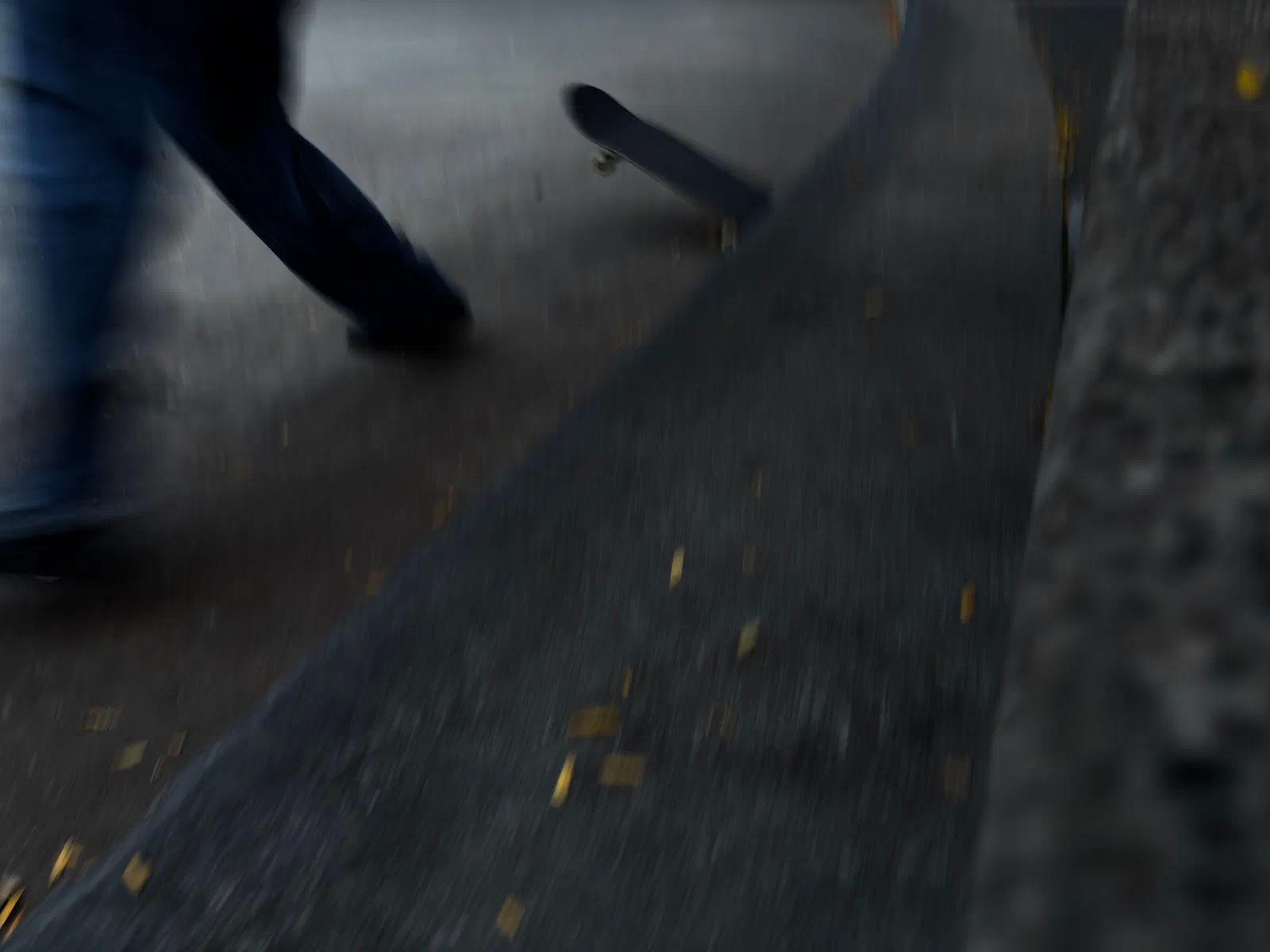 A skateboarder in motion, blurred, September 2026.