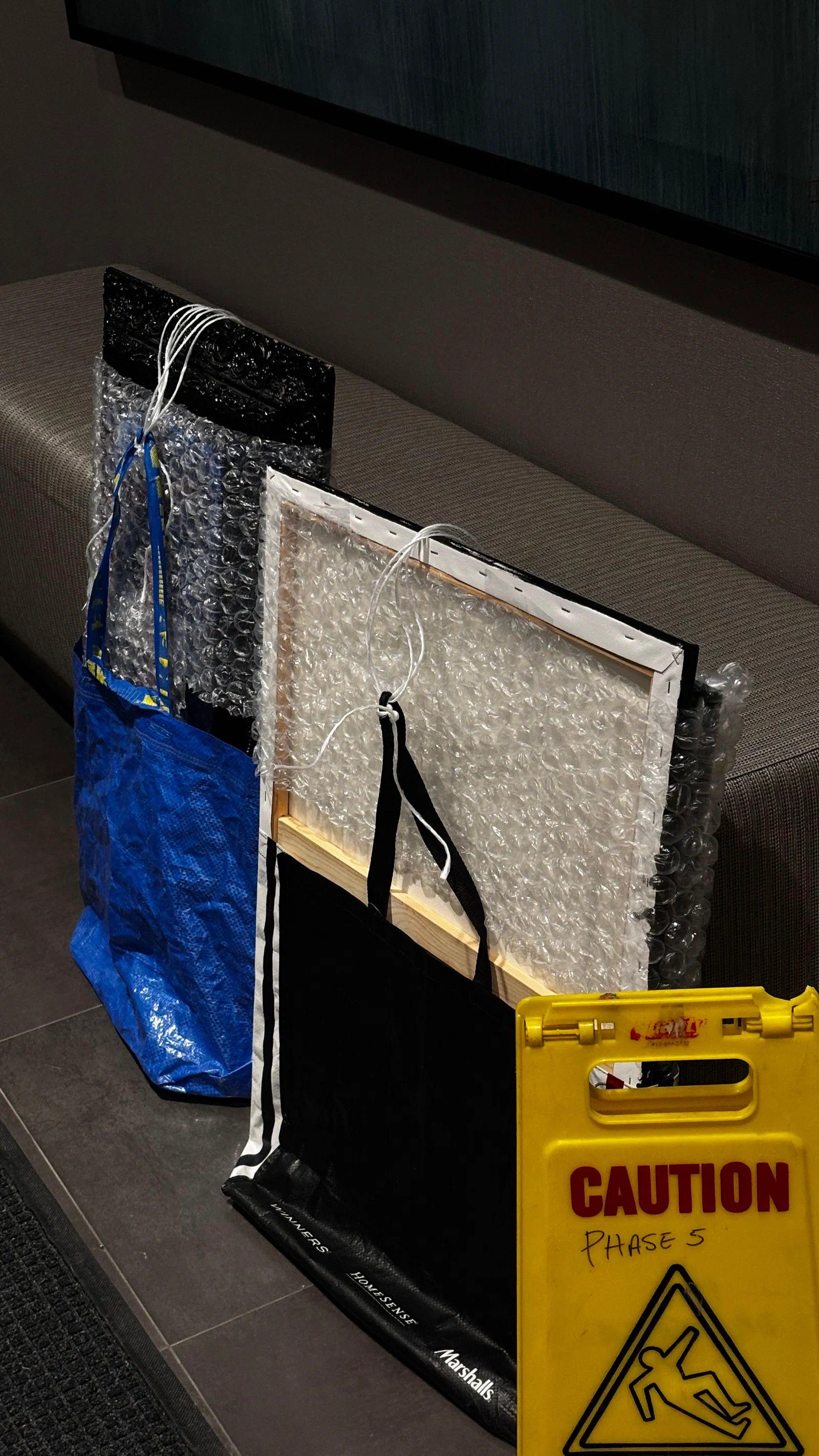 Paintings wrapped in bubble wrap, March 2026.