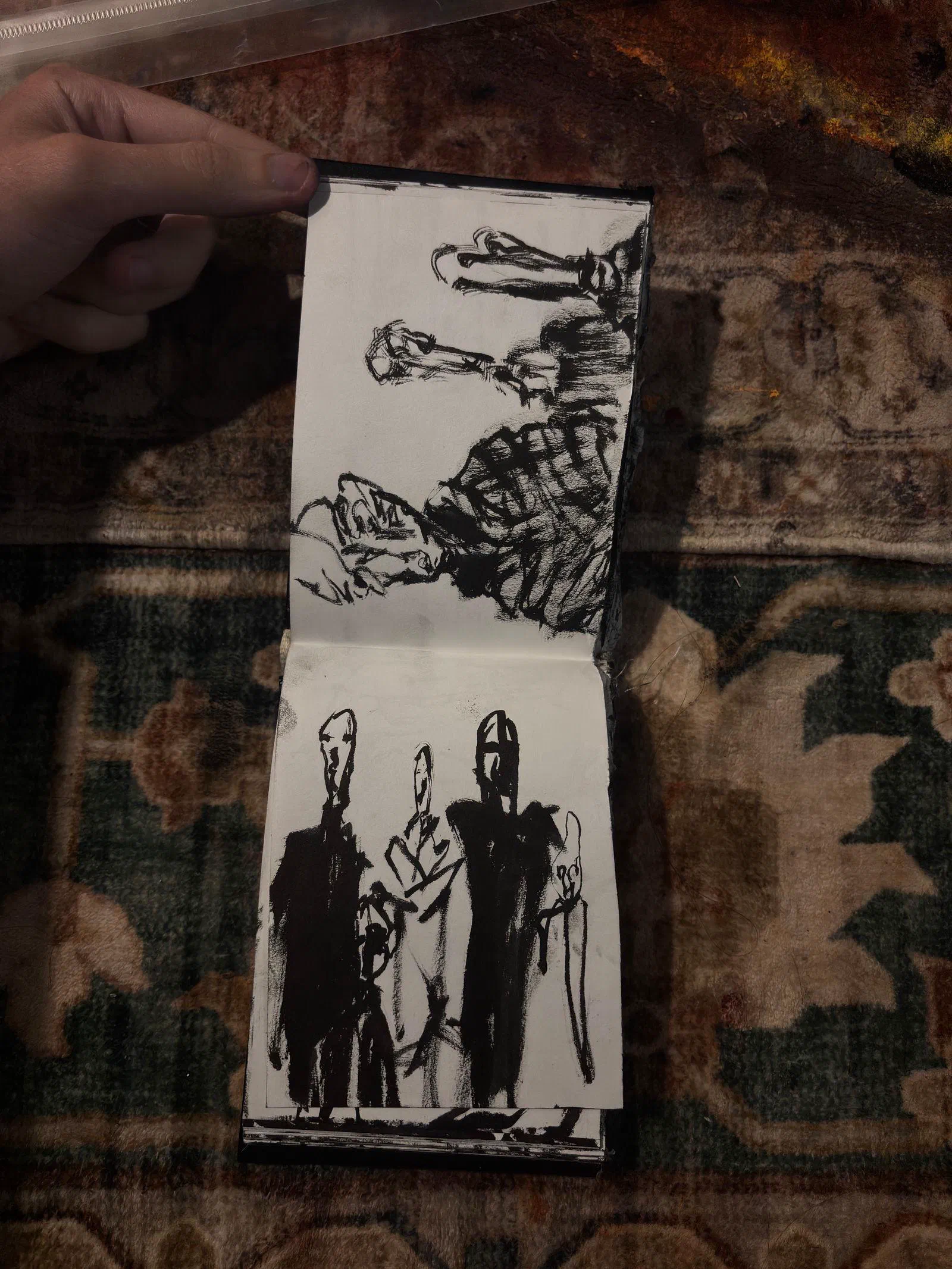 A sketchbook spread: heads above a group of standing figures, August 2026.