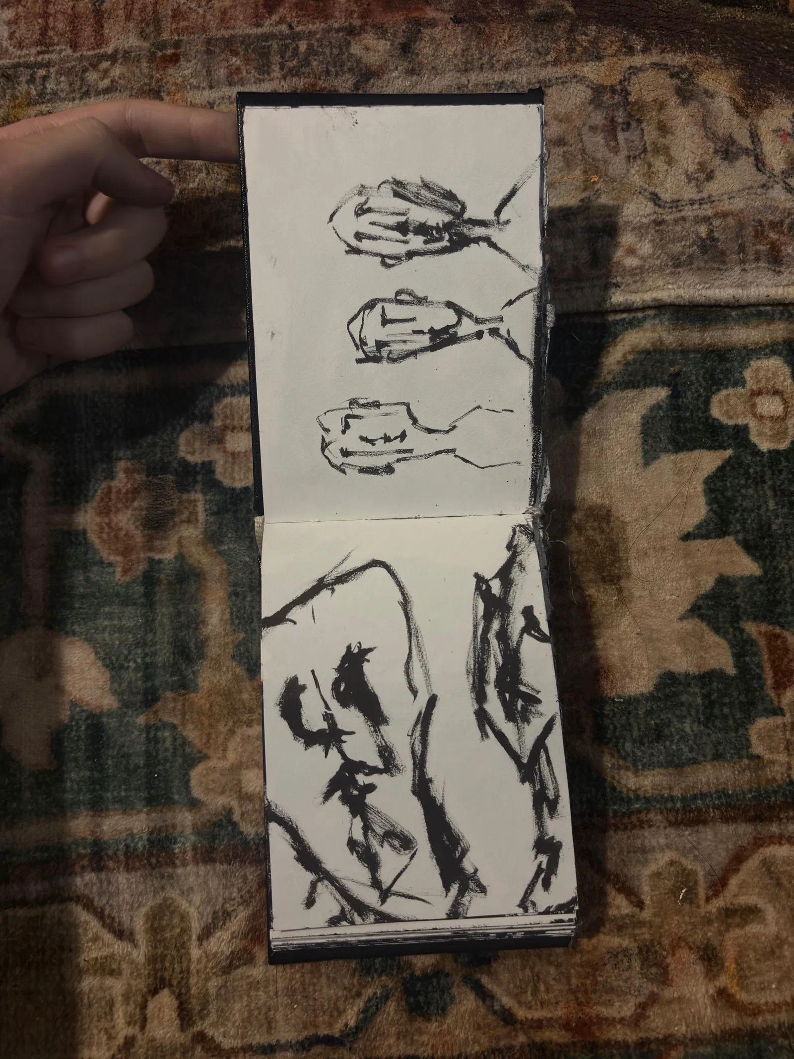 A sketchbook spread: three heads above a figure, August 2026.